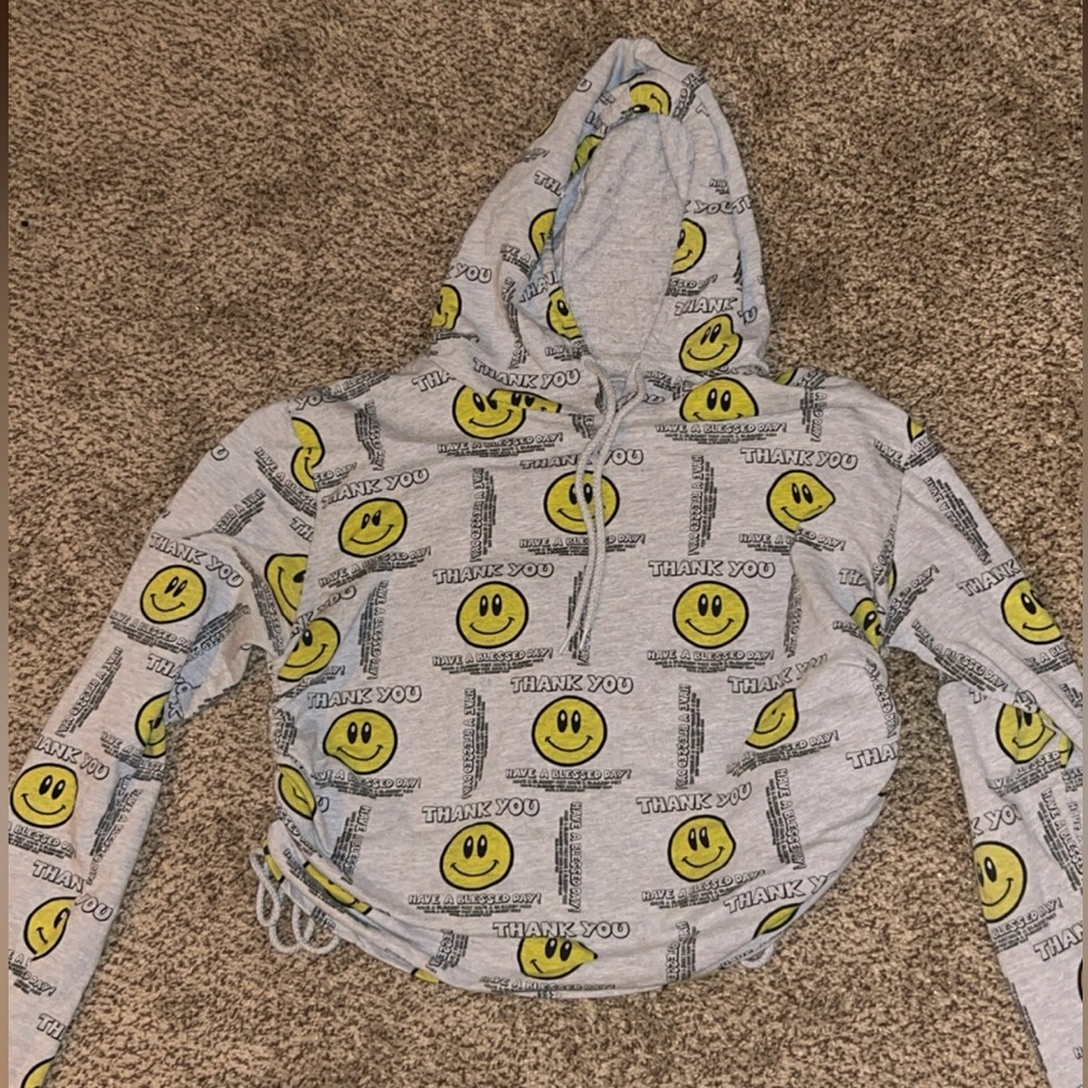 A cropped hoodie that shares kind messages to anyone reading. Size large.